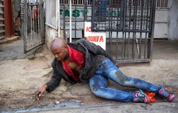 This Is Too Bad!! People Stood By While This Man Was Stabbed To Death In SA [See Photos]